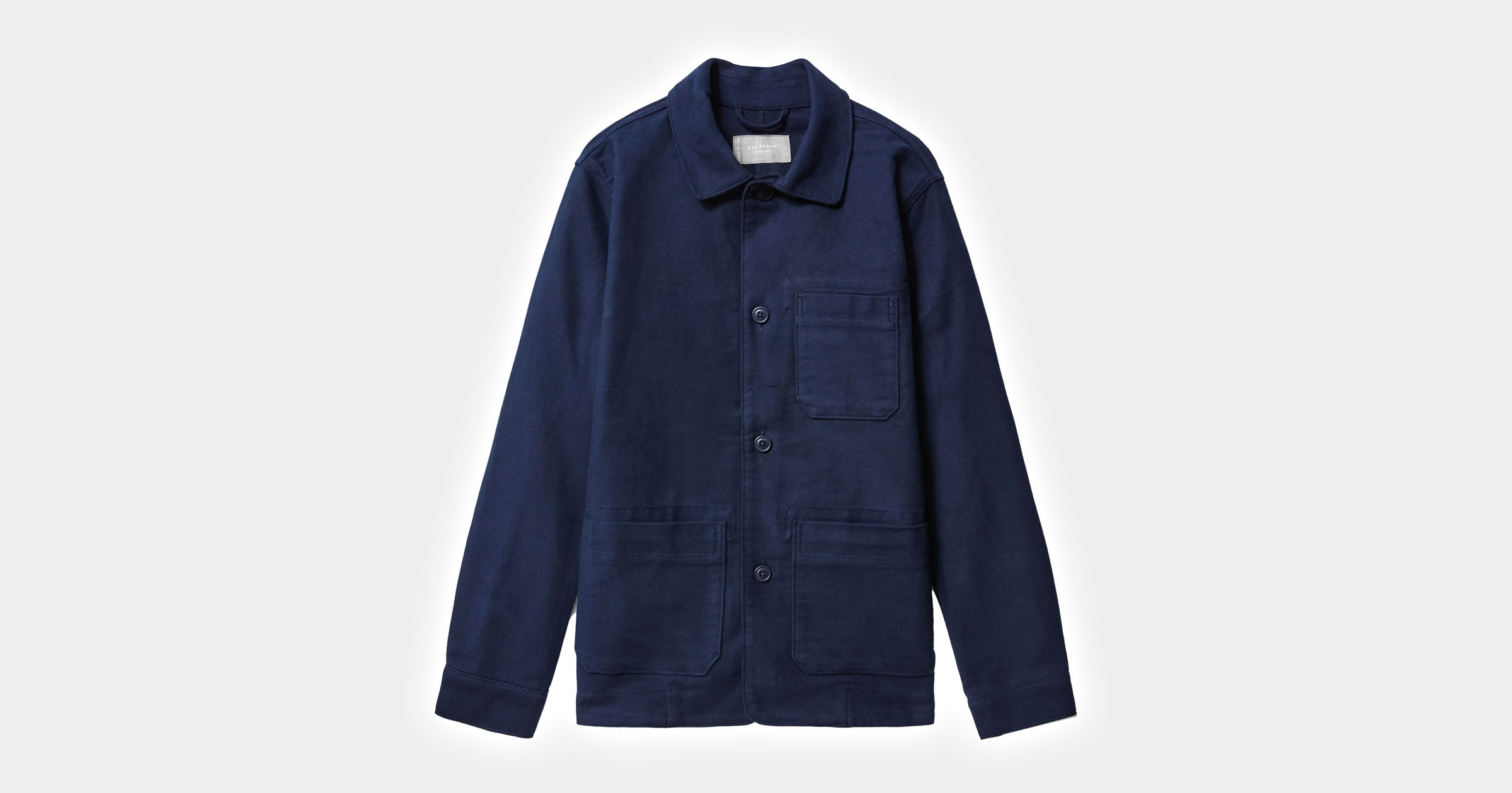 flatlay of navy chore coat
