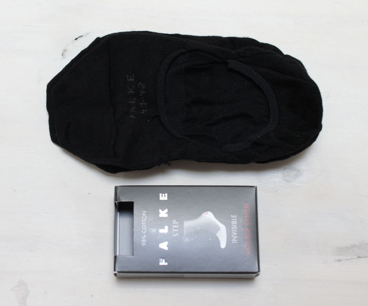 falke no show socks next to box