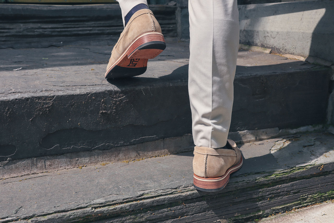 man wearing the HELM boots wilson loafer close-up walking up stairs