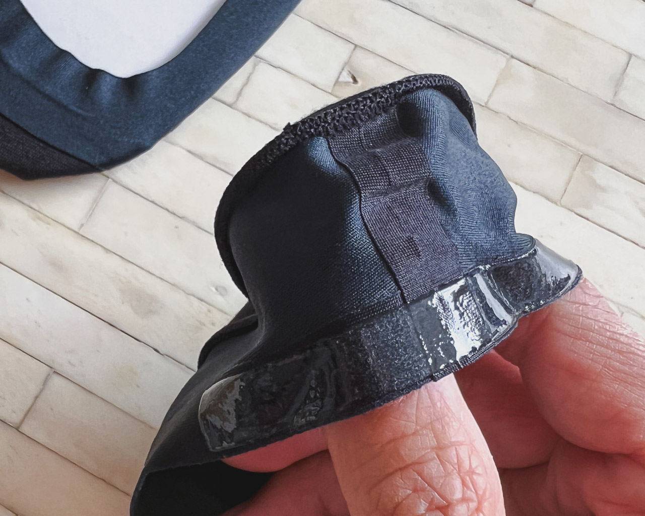 closeup of sock heel seam and silicone strip on black ondo no show socks