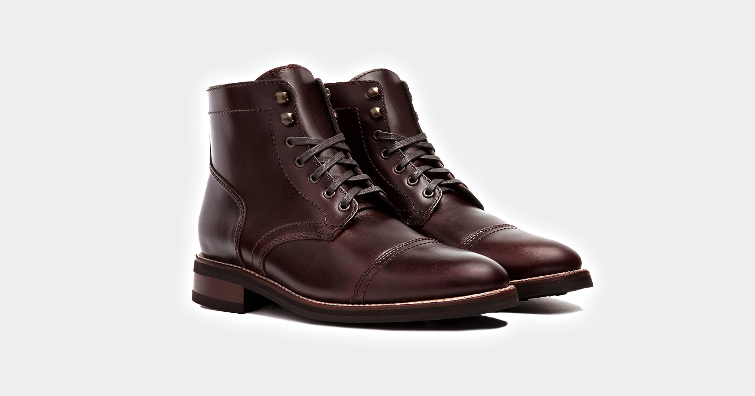 flatlay of brown leather boots