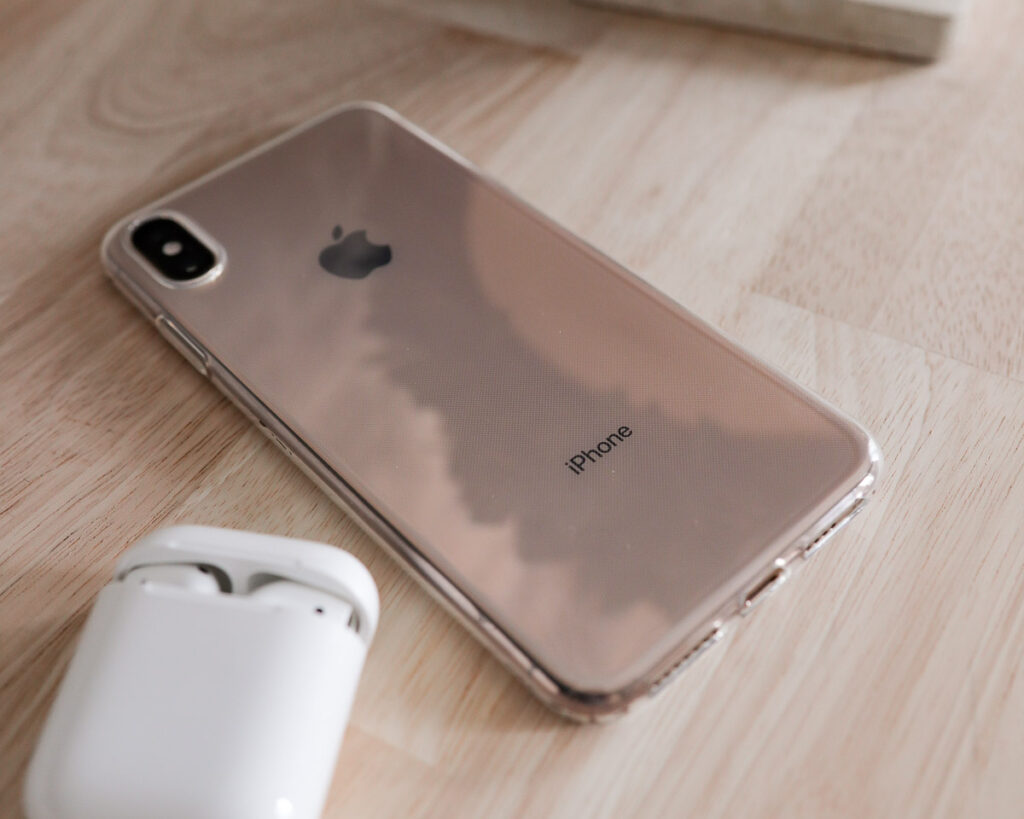 iphone XSMax with clear case and airpods headphones