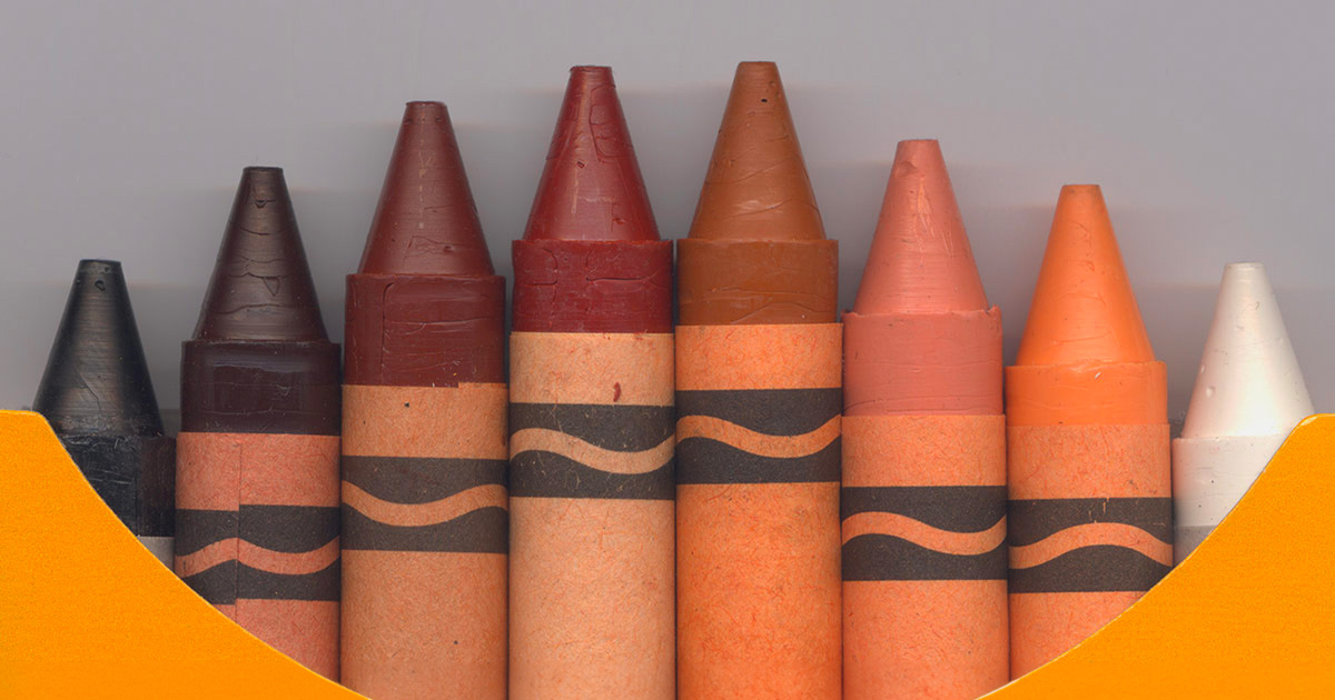 closeup of box of crayons with all skin tones