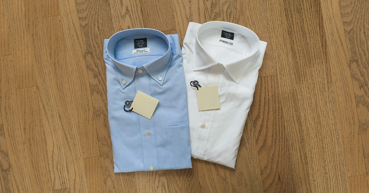 button up vs button down two shirts one blue button down collar and one white button up dress shirt