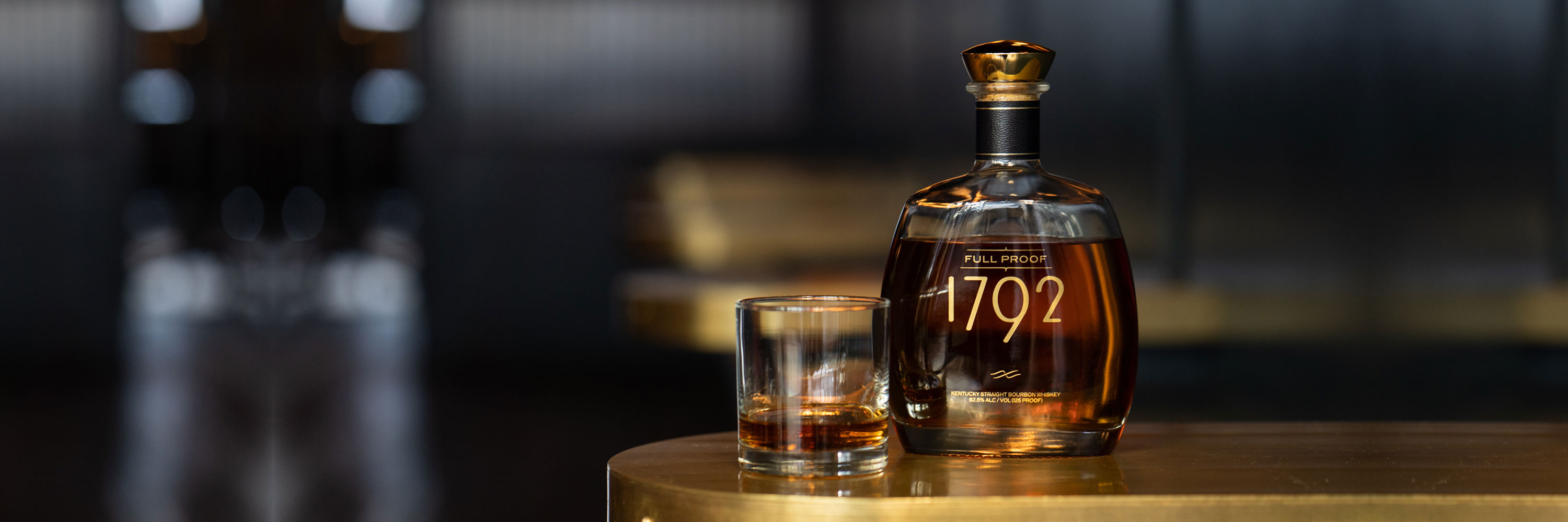 bottle of bourbon and bourbon poured in glass - how to do a bourbon tasting