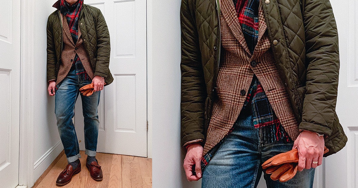 close up of man wearing jeans loafers and sportcoat with green quilted jacket