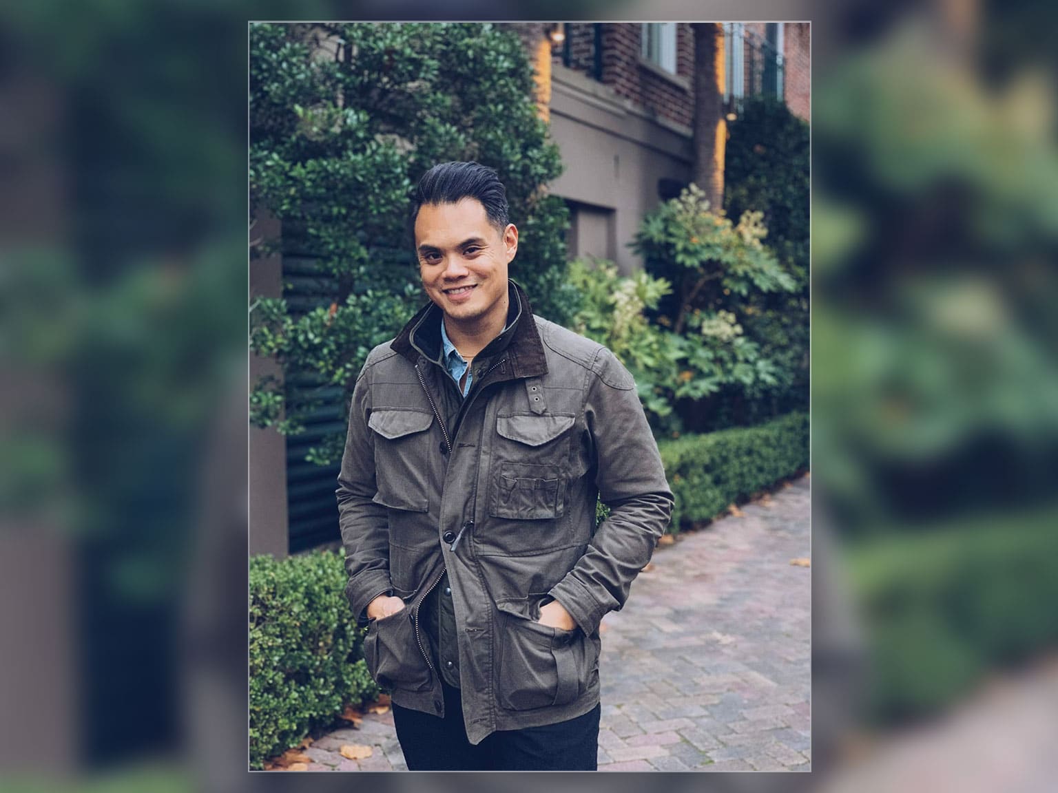 man wearing green field jacket with brown corduroy collar