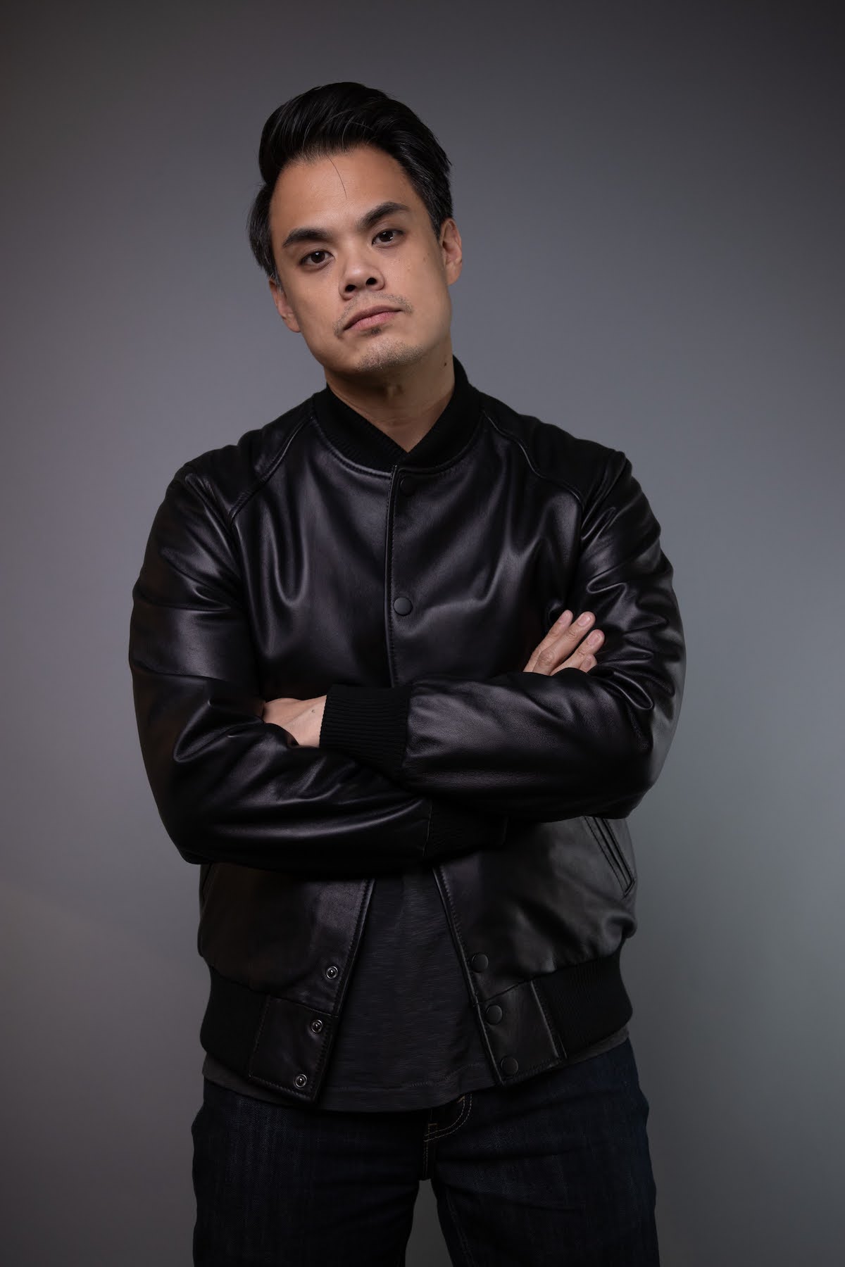 man wearing black bomber baseball leather jacket