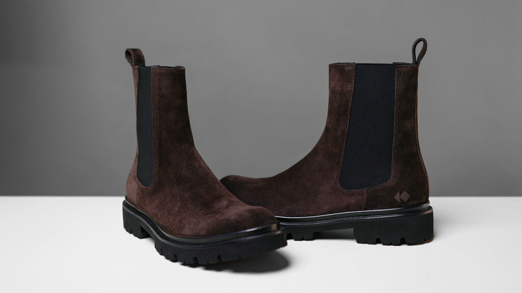brown koio chelsea boots on white table