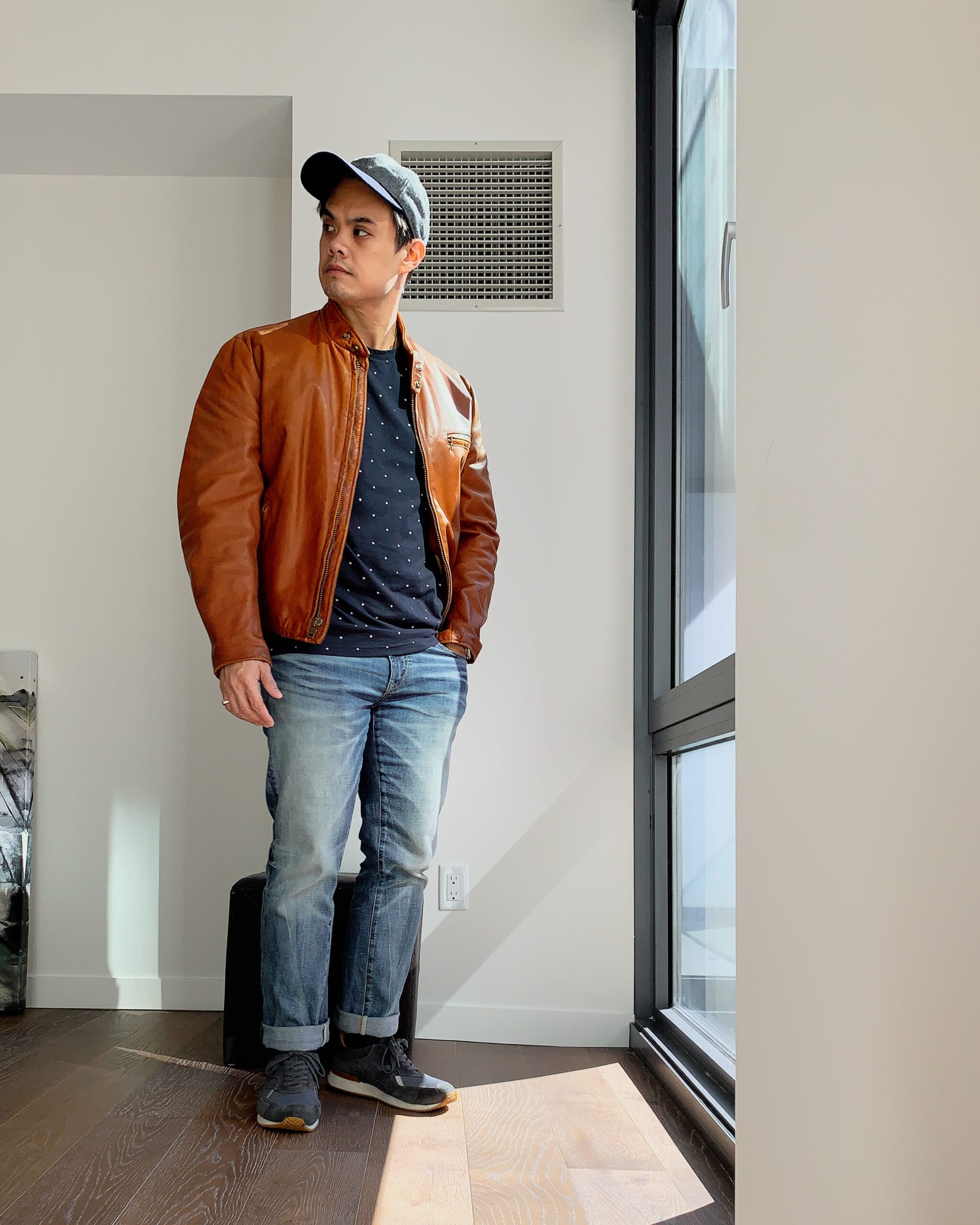 man wearing vintage cognac leather racer jacket from schott