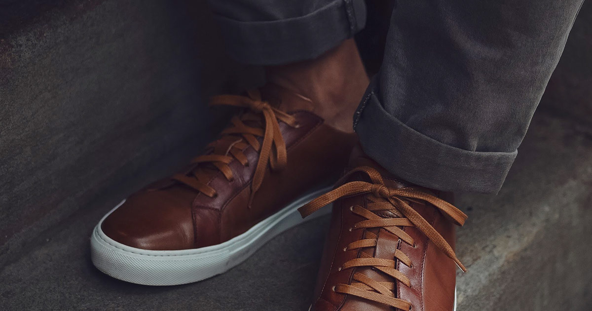 close up of ace marks sneakers on man