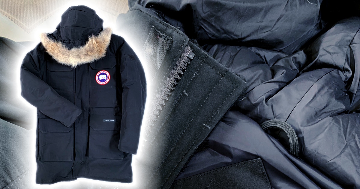 photo of a black down jacket with fur trim hood