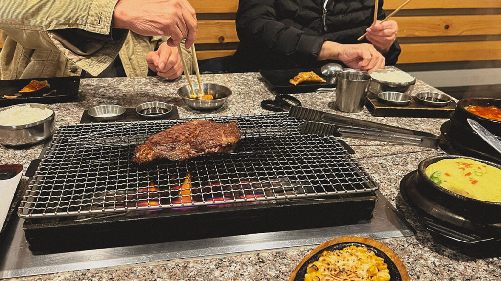 closeup of steak on a korean barbeque grill