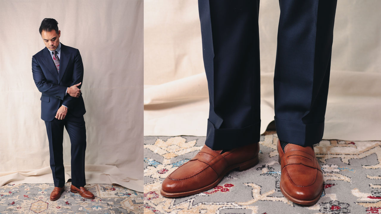 tan leather loafers with navy blue suit