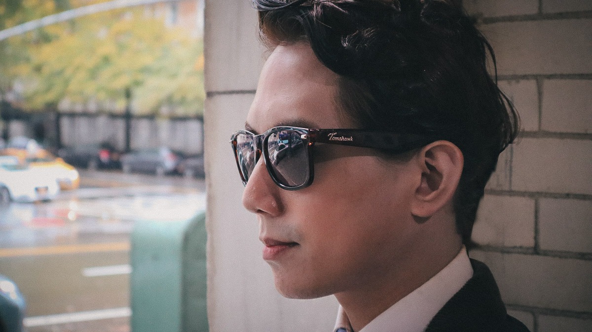 closeup of man wearing tomahawk glasses in sun
